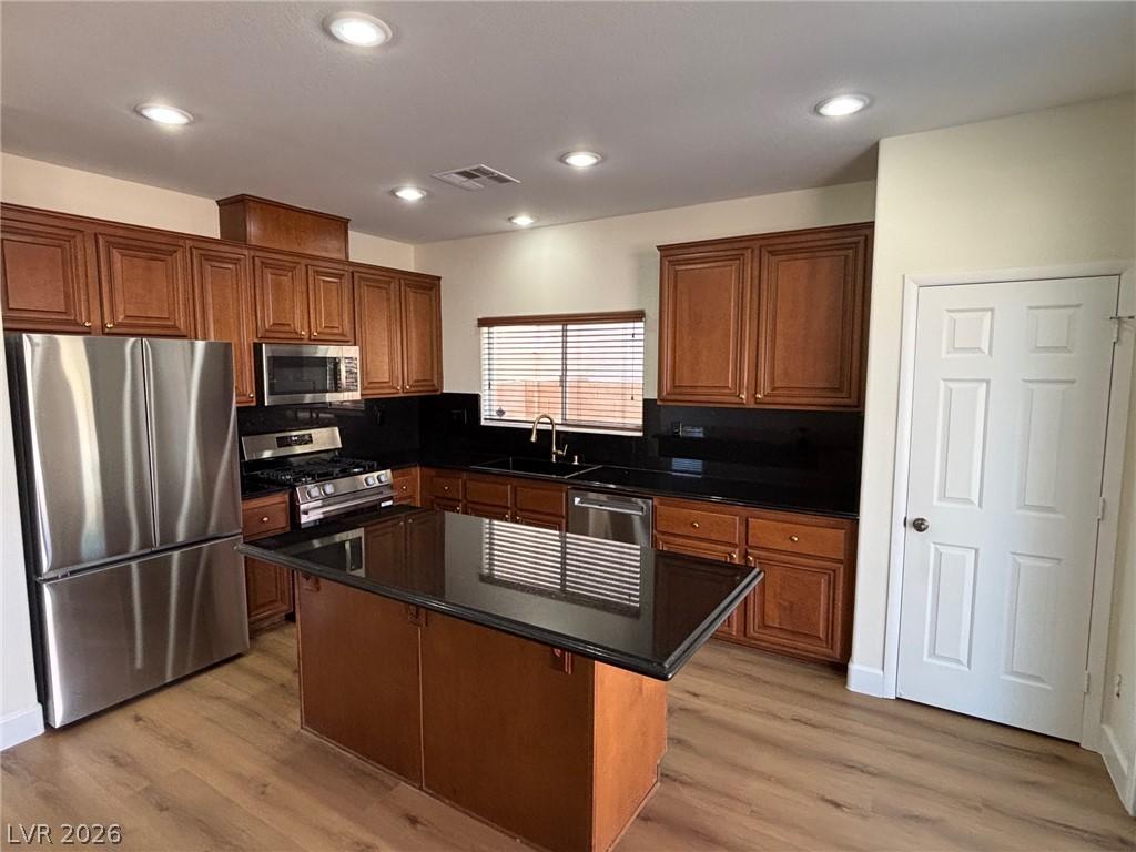Image 4: A contemporary kitchen showcasing rich cabinetry,