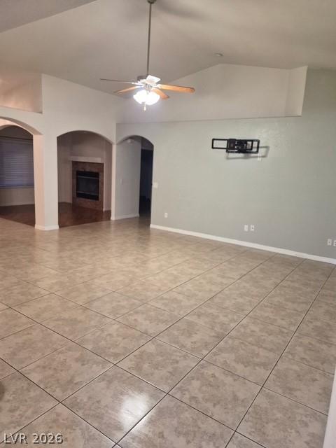 Image 2: The spacious living area boasts vaulted ceilings a