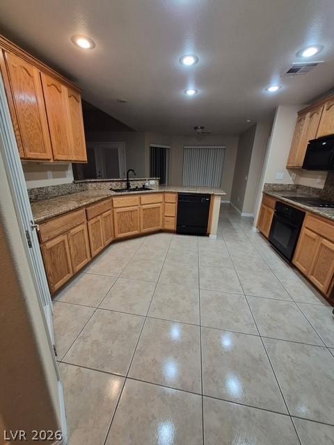 Image 4: A well-appointed culinary space featuring ample ca