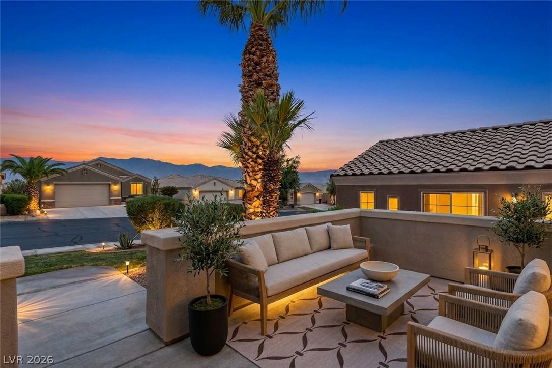 Image 1: An inviting outdoor patio offers serene mountain v