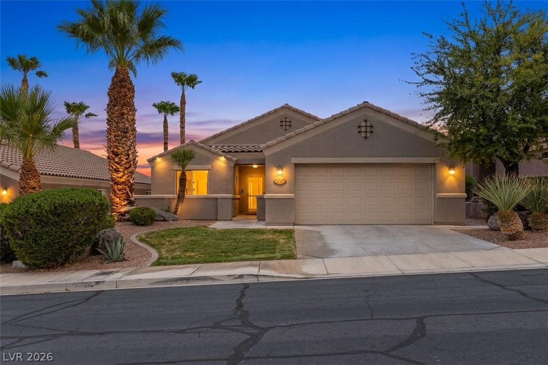 Image 2: An inviting exterior with desert-friendly landscap
