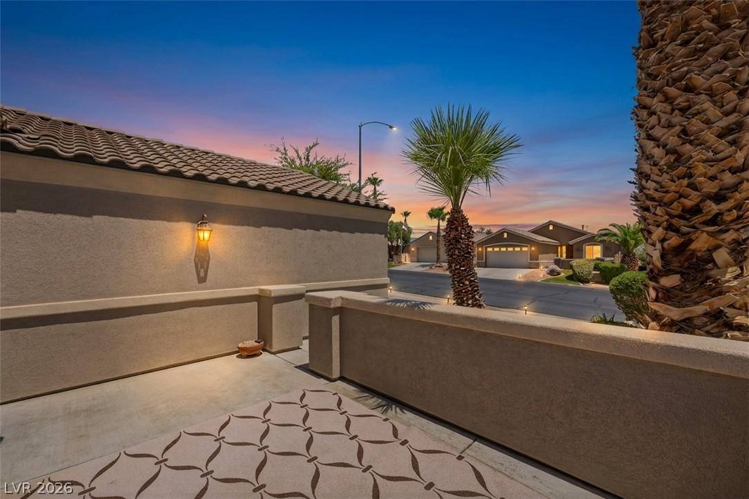 Image 3: Twilight hues illuminate this inviting patio space