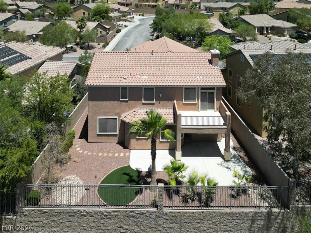 Image 2: An aerial perspective reveals large backyard with