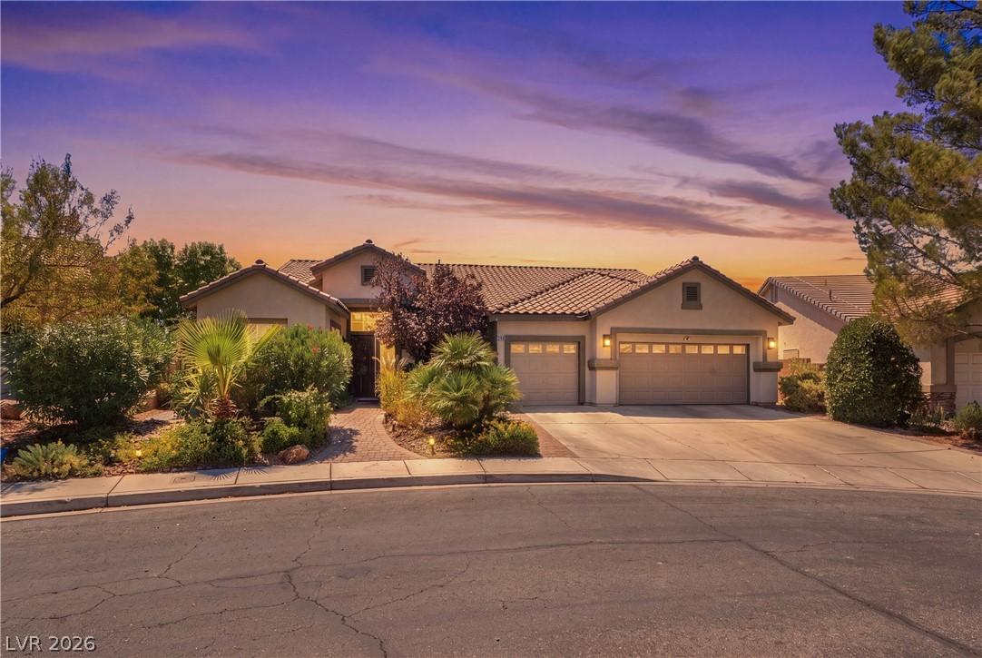 Image 2: An inviting exterior with a desert-inspired landsc
