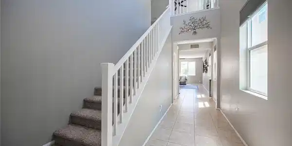 Image 3: A grand entrance welcomes guests with high ceiling