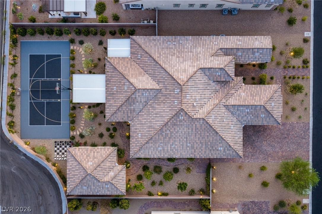 Image 2: An aerial perspective showcases a home with a terr