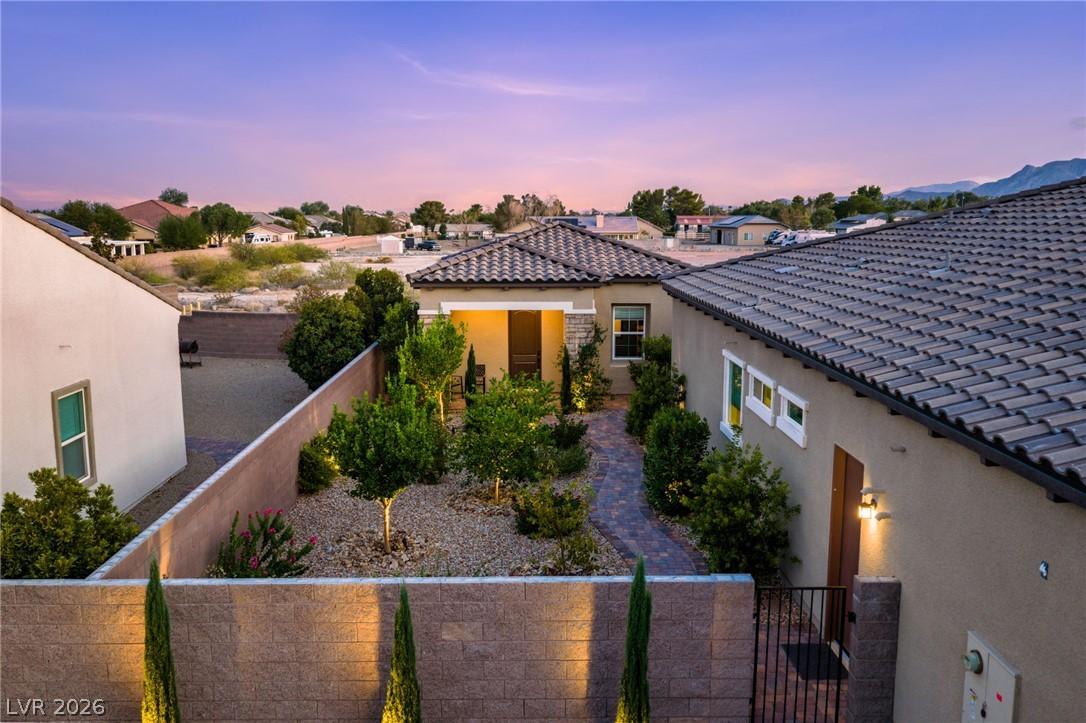 Image 4: A private, landscaped courtyard welcomes you to Ca
