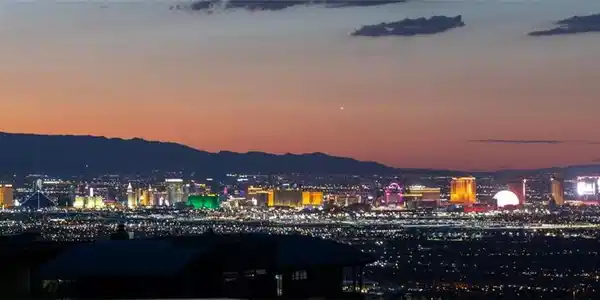 Image 2: Dusk settles over the glittering city skyline nest
