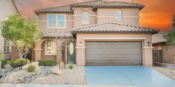 Image 4: Spanish tile roofing and stucco exterior walls cre