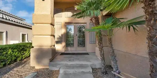 Image 2: Ornate glass double doors welcome you to this appe