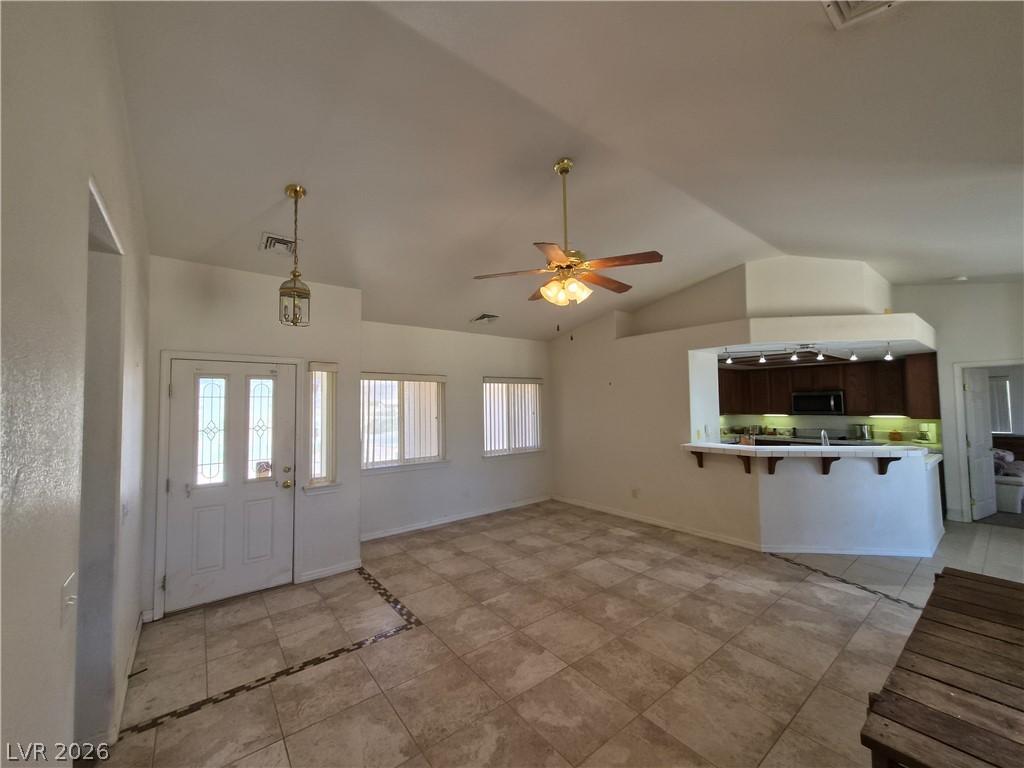 Image 4: An inviting open floorplan welcomes with tile floo