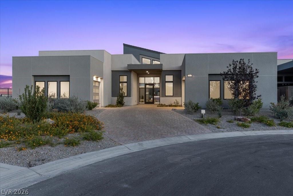 Image 3: A modern architectural marvel welcomes with a pave
