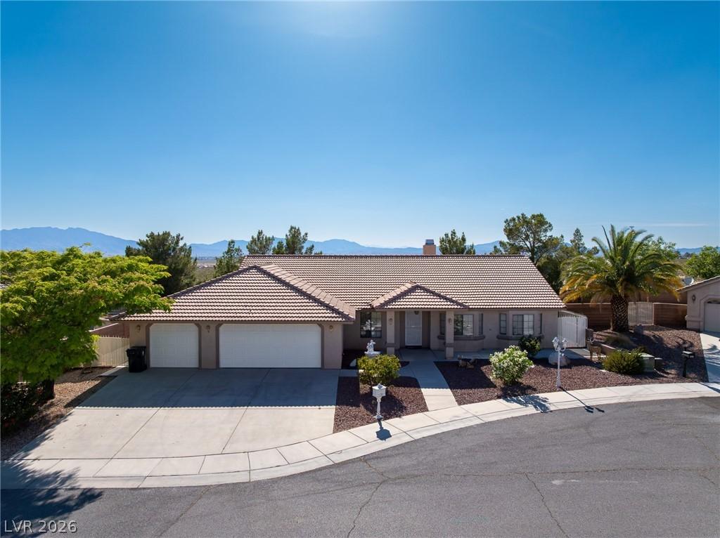 Image 1: This desert oasis features a classic tiled roof an