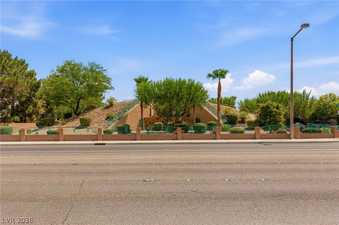 Image 1: A desert oasis with vibrant greenery and a distinc