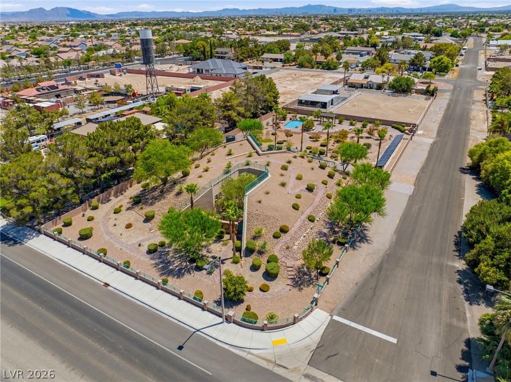 Image 2: An aerial perspective reveals a large corner lot w