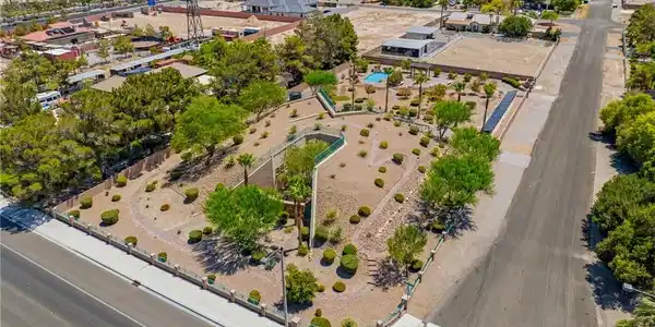 Image 2: An aerial perspective reveals a large corner lot w