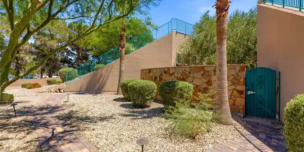 Image 3: A charming walkway leads through drought-tolerant