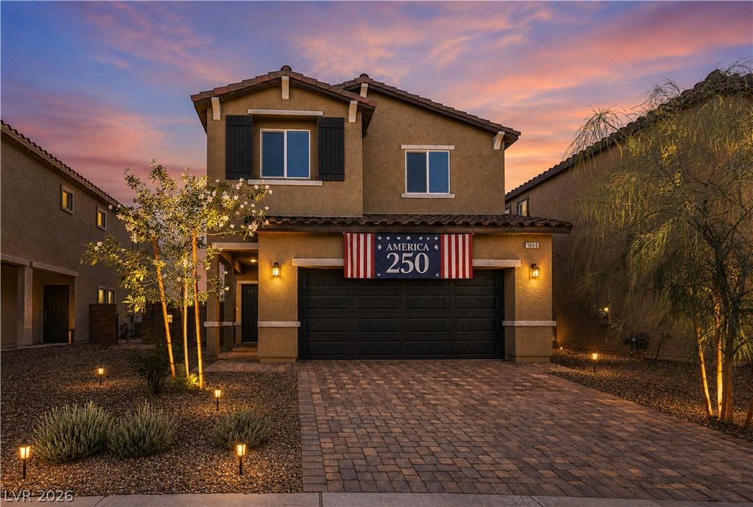 Image 2: Illuminated landscaping enhances this home's invit