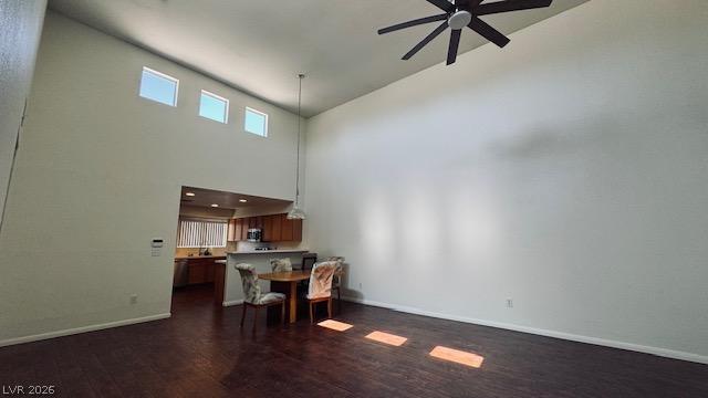 Image 4: High ceilings and rich dark flooring define this o
