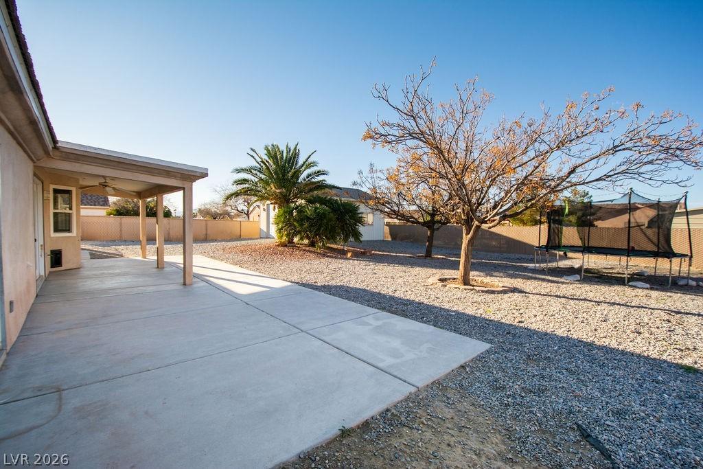 Image 4: Fenced backyard featuring a patio area, a ceiling