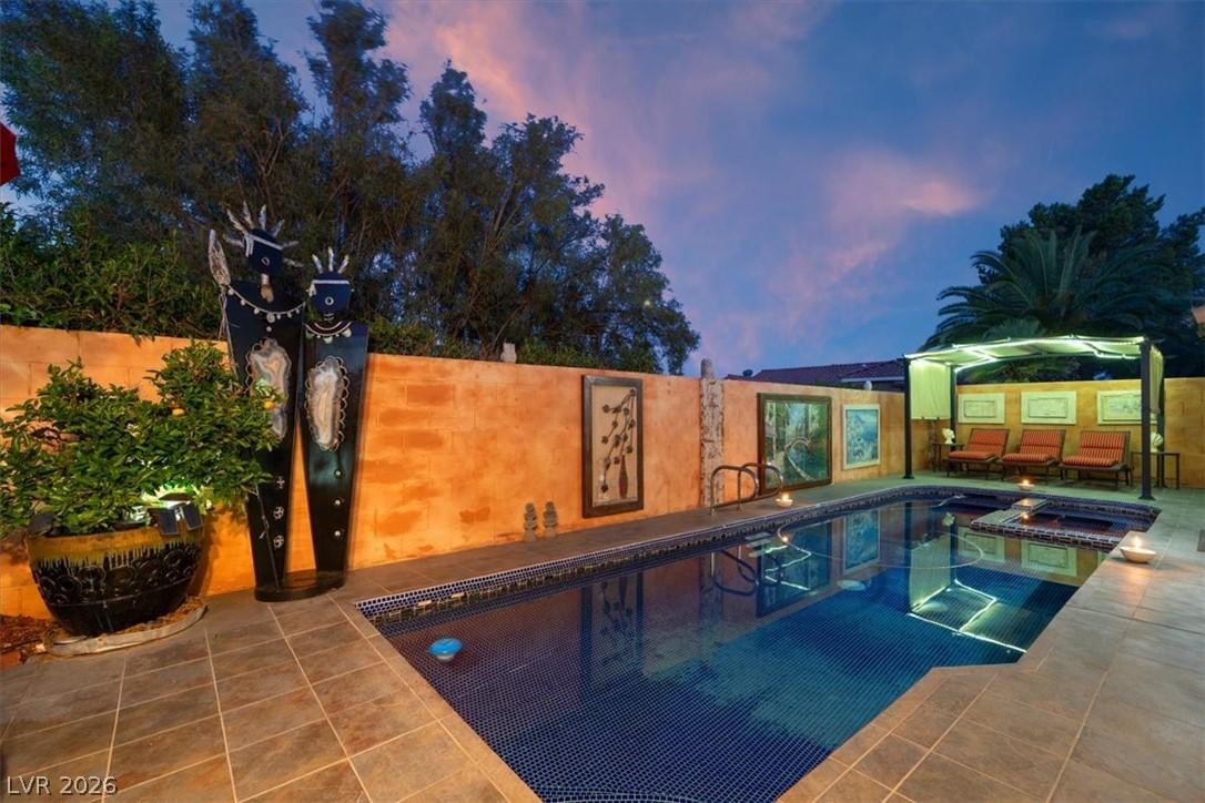 Image 1: An inviting private pool and spa create a serene b