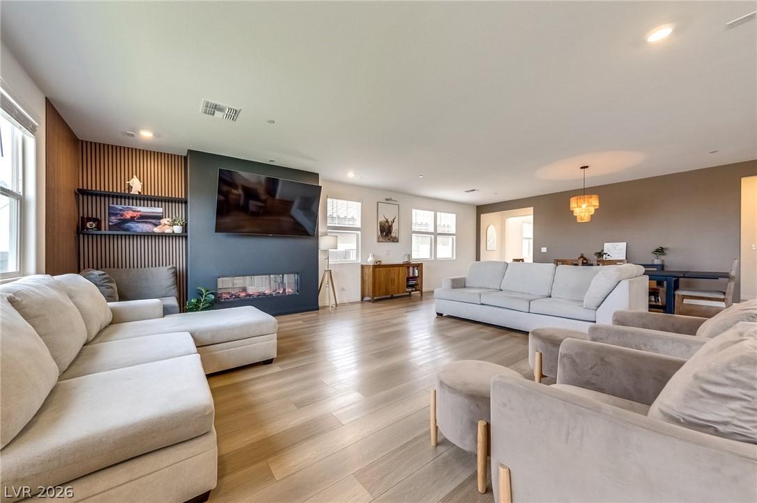 Image 4: This bright and open-concept living space features
