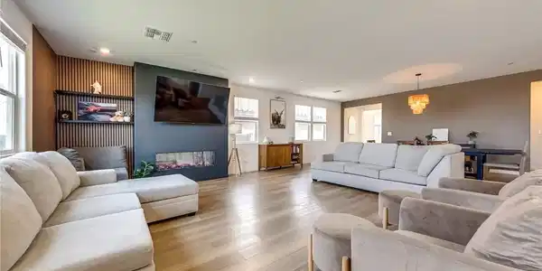 Image 4: This bright and open-concept living space features