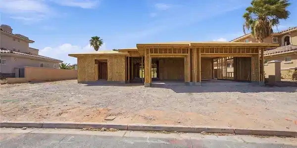 Image 2: A new construction home with an attached garage aw