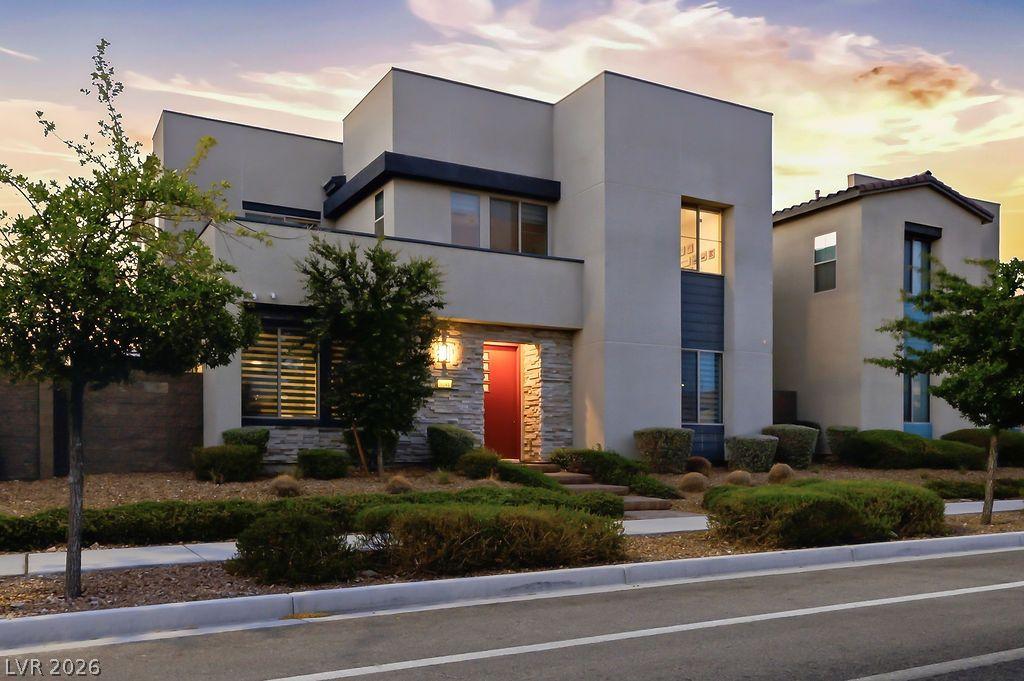 Image 2: Modern architecture with clean lines and a bold en
