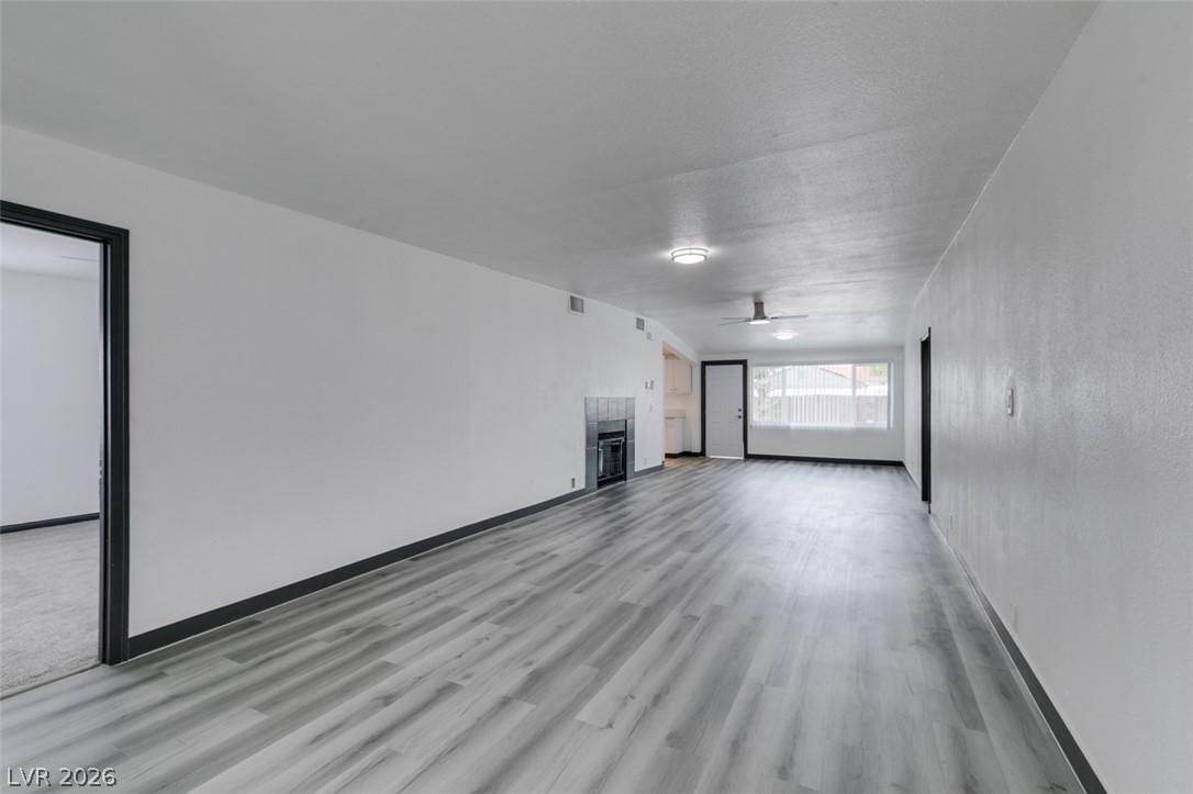 Image 4: A spacious, open-concept interior featuring light