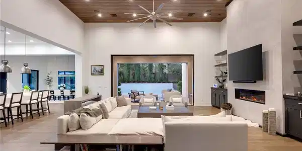 Image 3: Rich wood plank ceilings and a sleek linear firepl