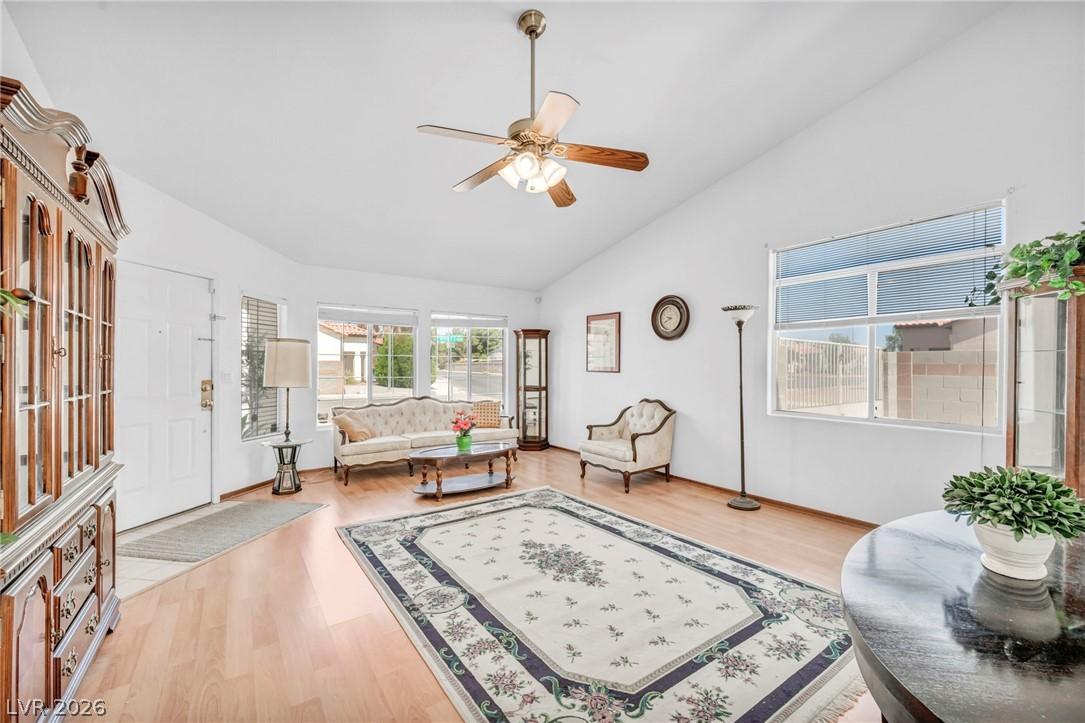 Image 4: A welcoming living area presents vaulted ceilings,
