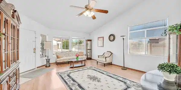 Image 4: A welcoming living area presents vaulted ceilings,