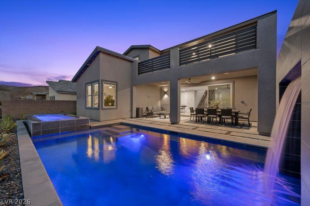 Image 2: An inviting backyard oasis awaits with a shimmerin