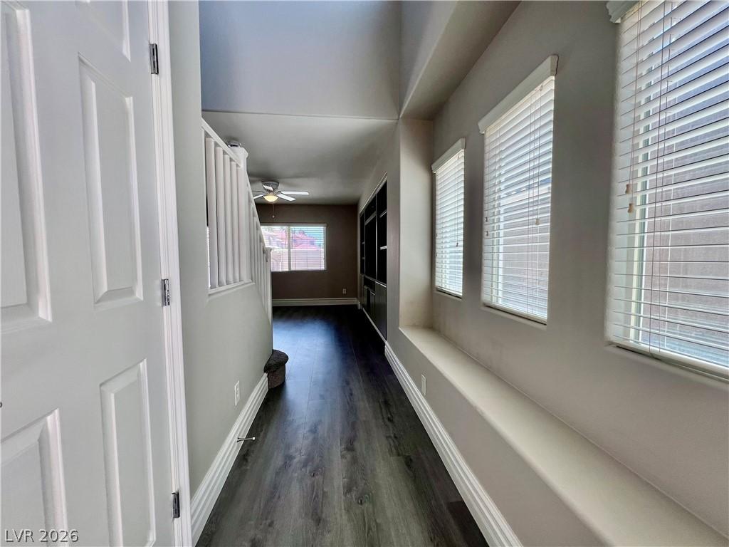 Image 3: A gracefully designed entryway features rich wood