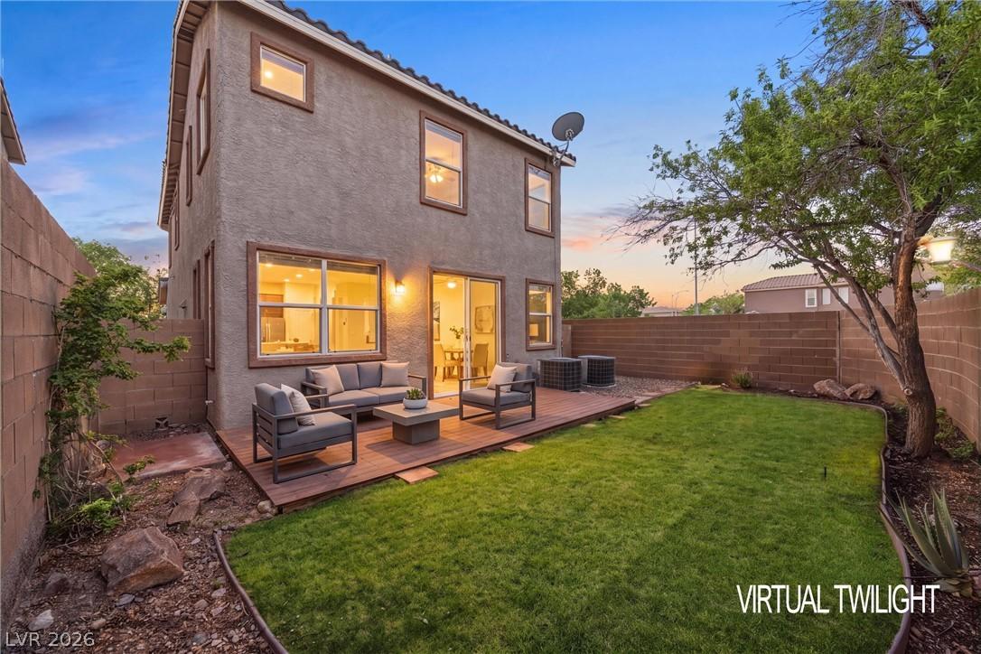 Image 3: A private backyard with a comfortable patio deck e