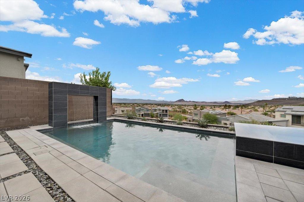 Image 3: An inviting private pool and water feature complem