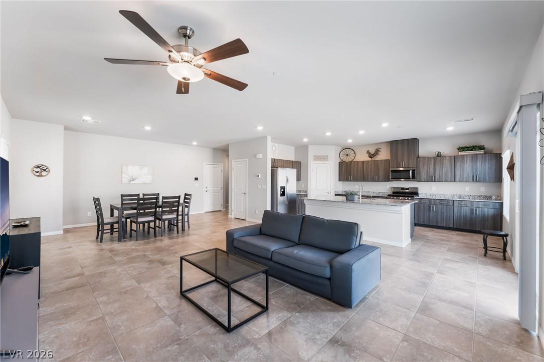 Image 3: An open-concept living space integrates a well-app