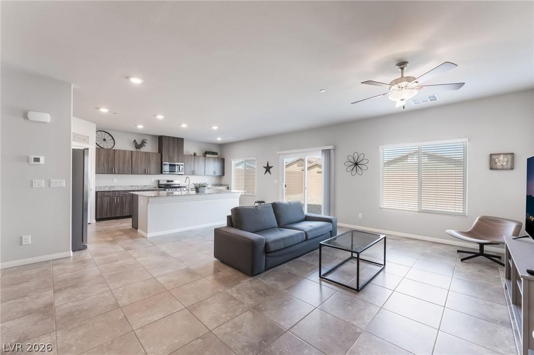 Image 4: An open-concept living space with a contemporary k