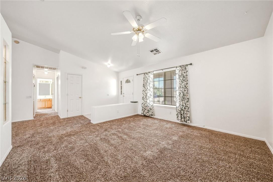 Image 3: A welcoming living area provides comfortable carpe