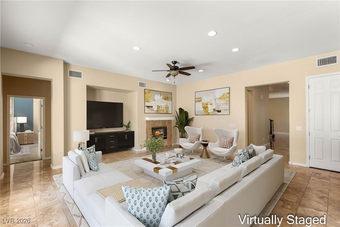 Image 2: Living room featuring a high end fireplace, recess