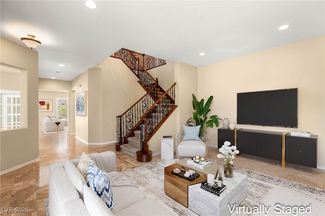 Image 3: Living room with stairway, recessed lighting, and