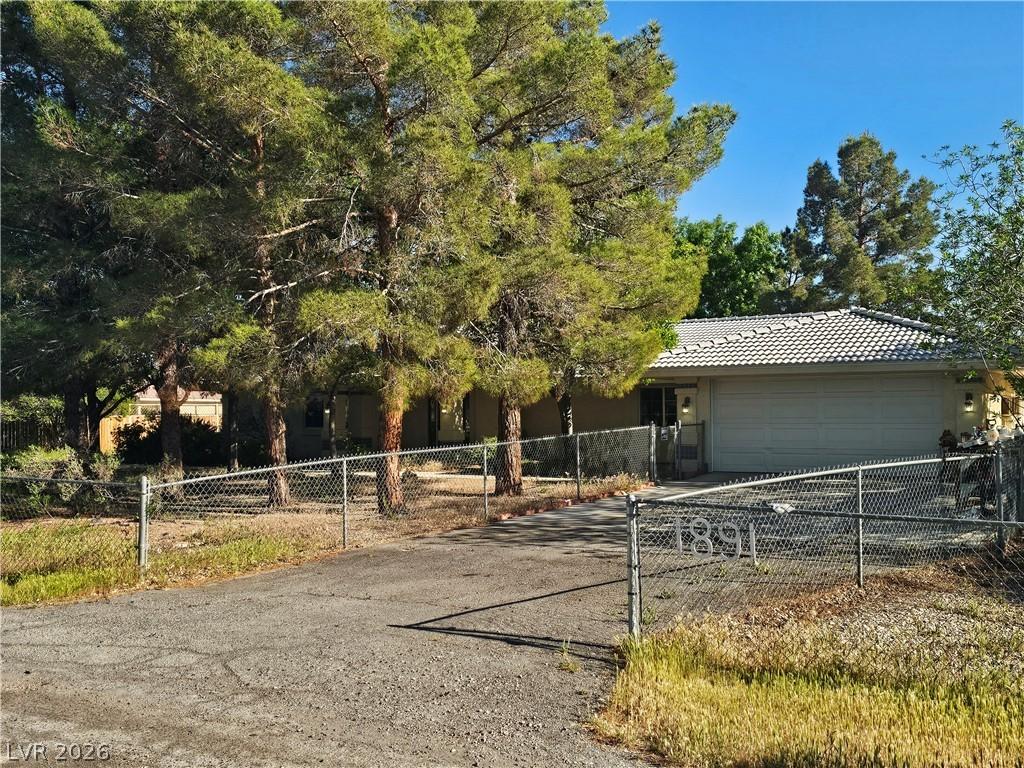 Image 2: View of front of home featuring a fenced front yar