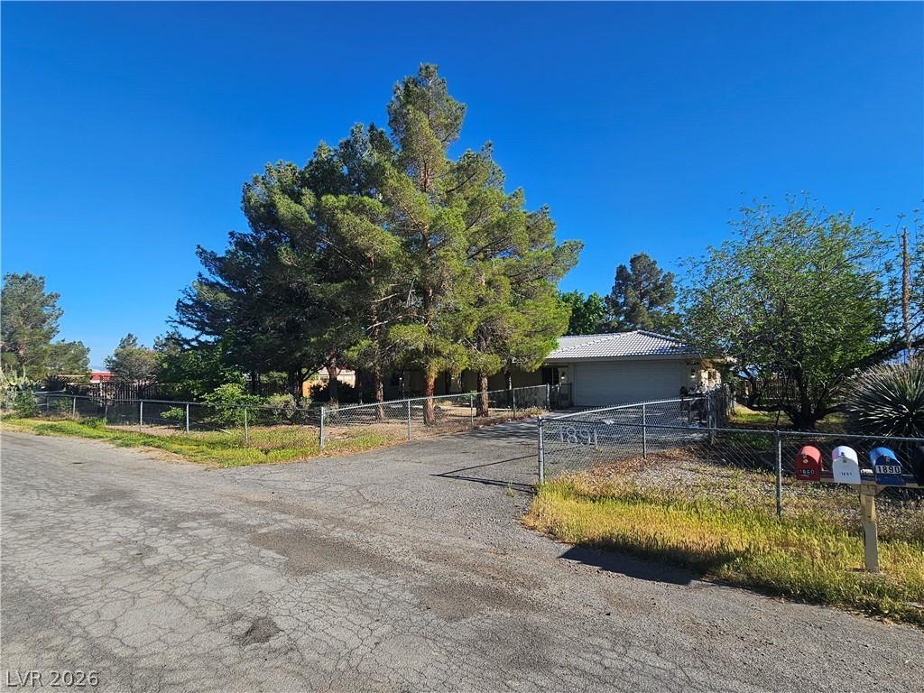 Image 3: Obstructed view of property featuring a fenced fro