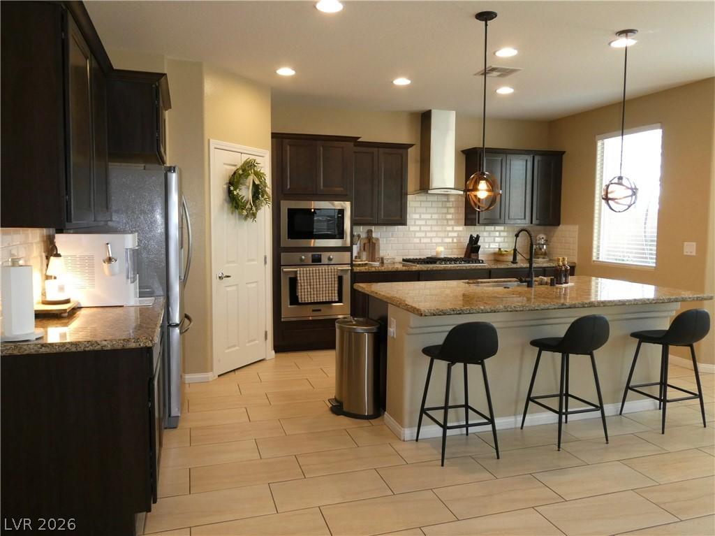 Image 3: A well-appointed culinary space featuring sleek ap