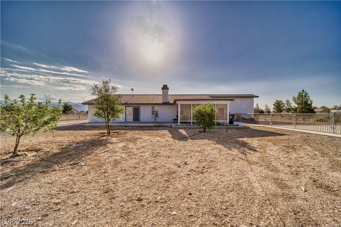 Image 4: A desert oasis home, featuring a screened patio an