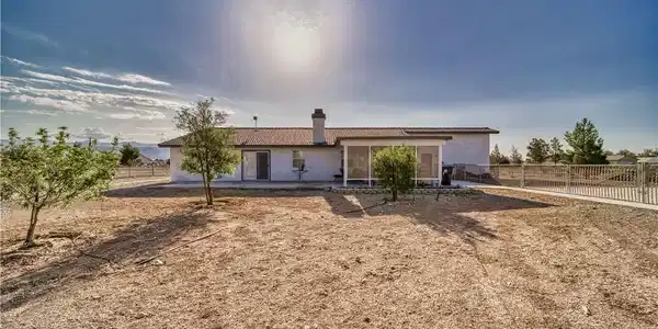 Image 4: A desert oasis home, featuring a screened patio an