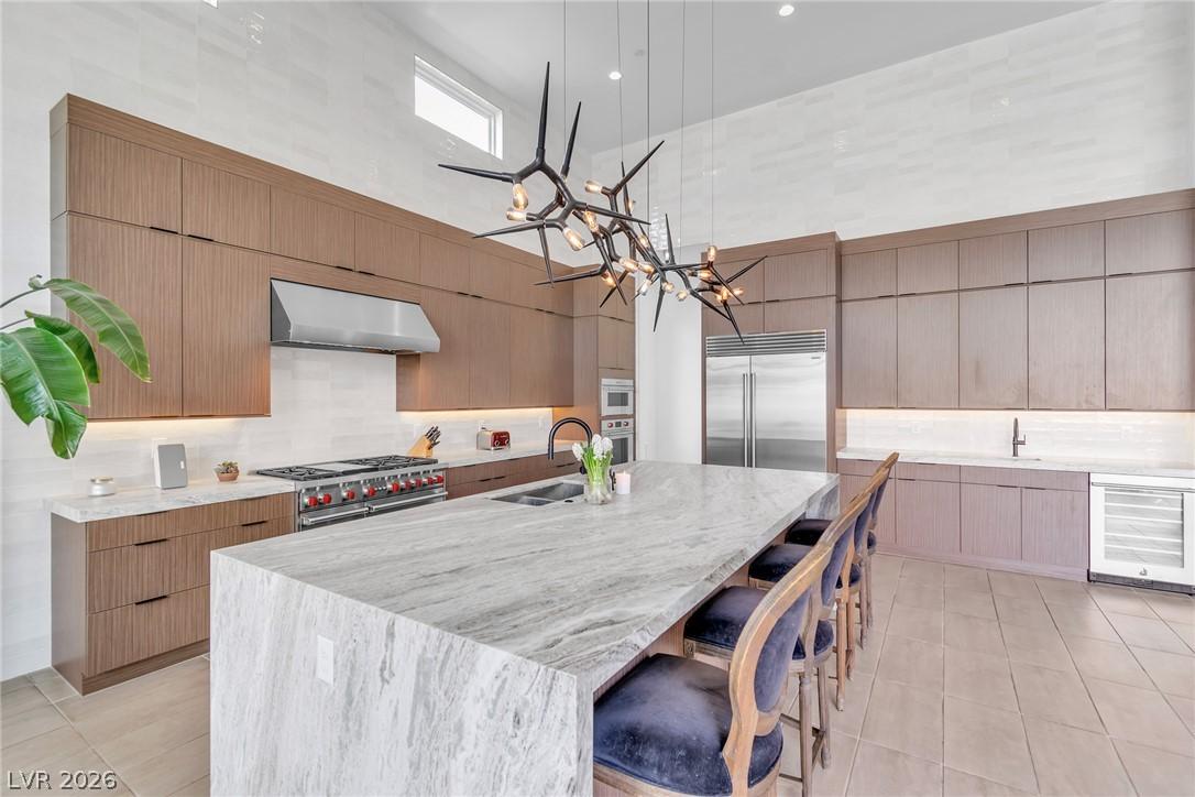 Image 2: An avant-garde chandelier illuminates a spacious k