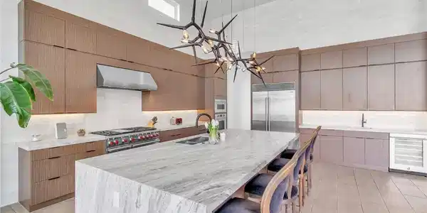 Image 2: An avant-garde chandelier illuminates a spacious k