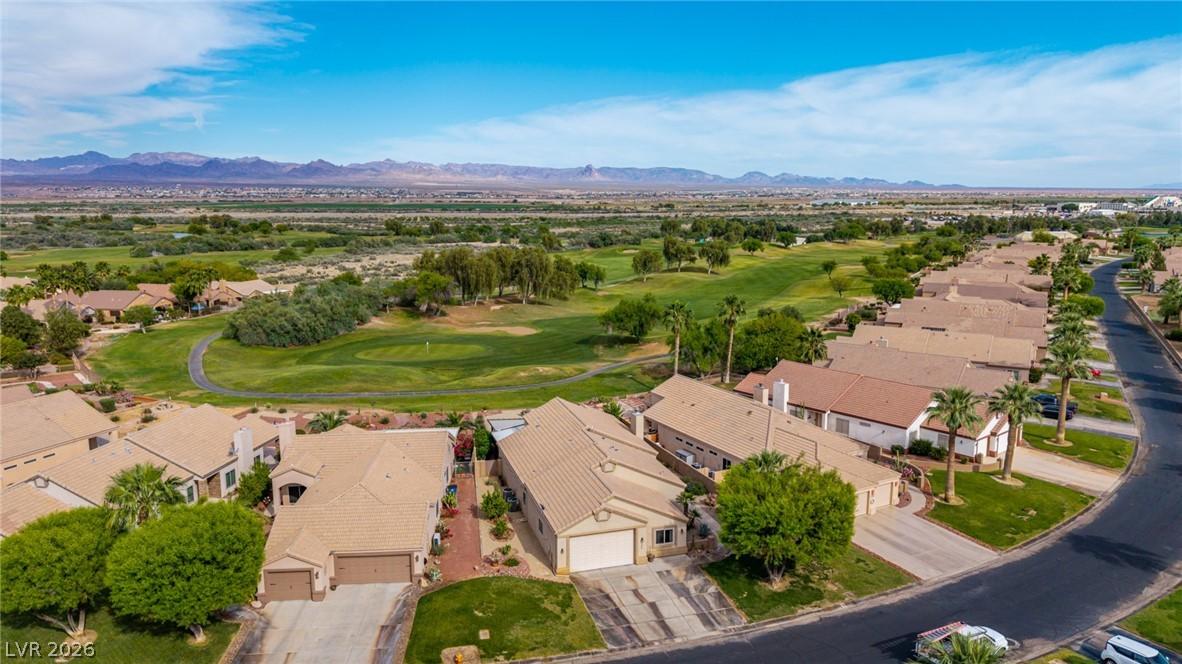 Image 3: Aerial perspective of suburban area with a golf cl